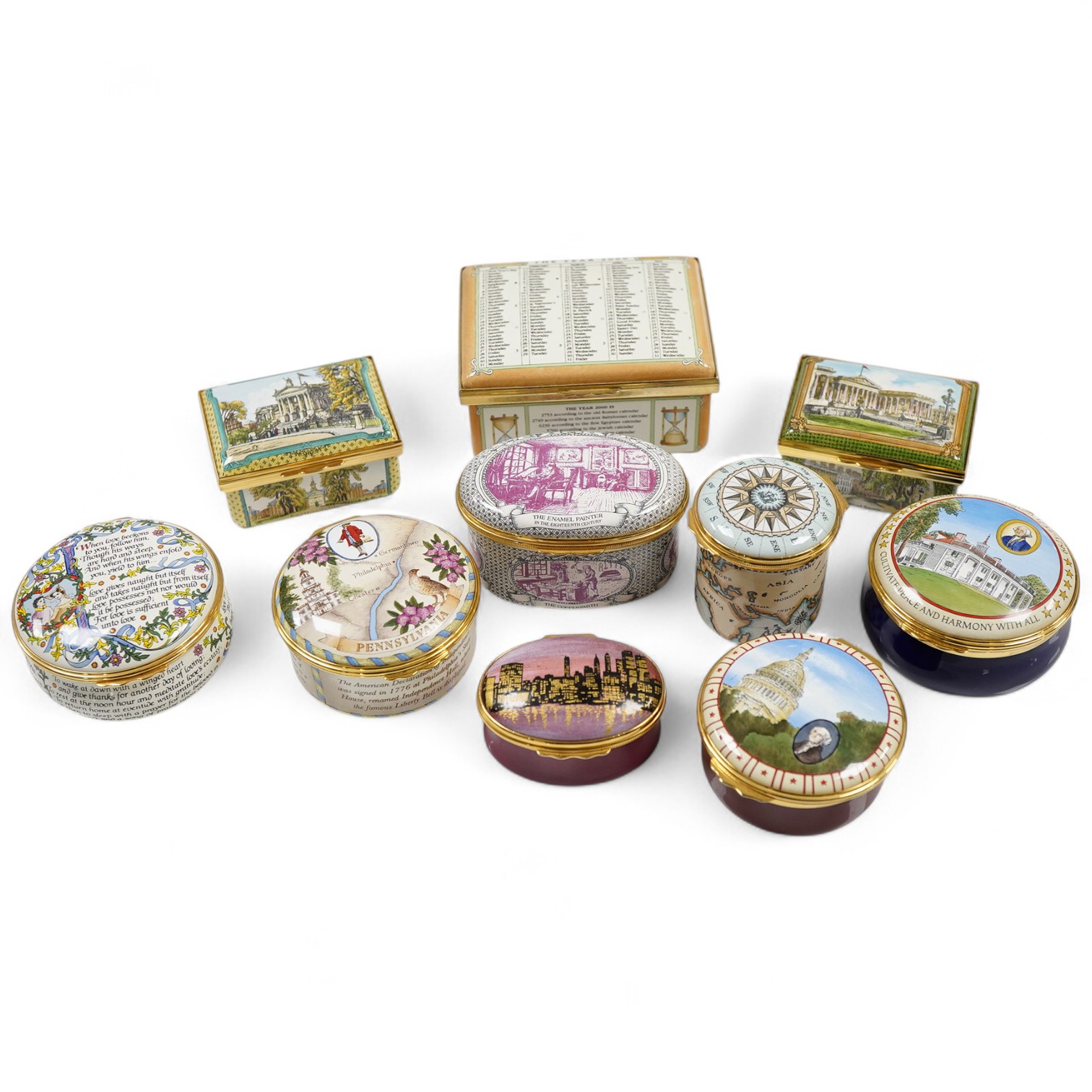 A group of ten Halcyon Days enamel boxes, mostly USA related
